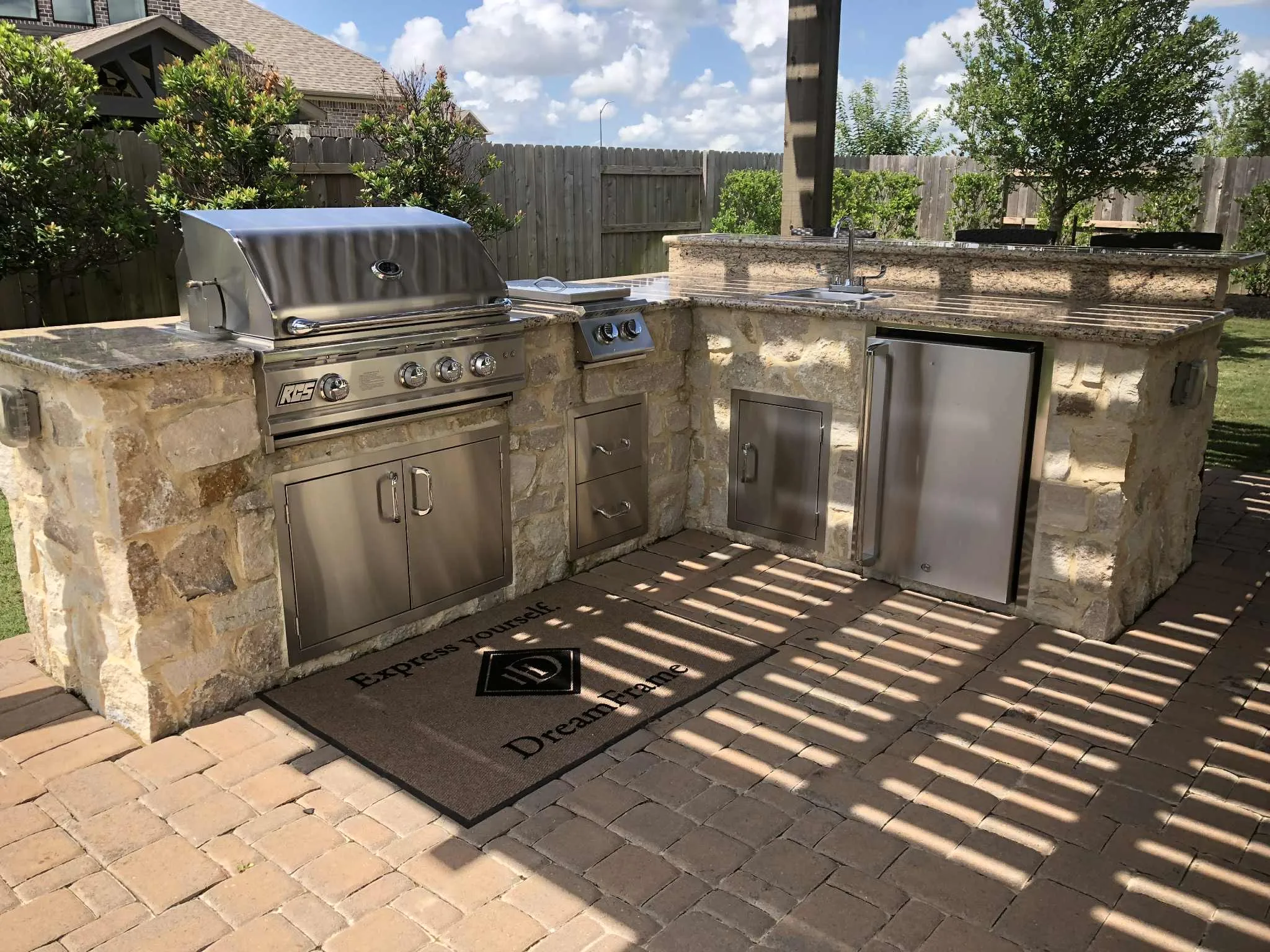 Outdoor kitchen stone rcs grill in Houston